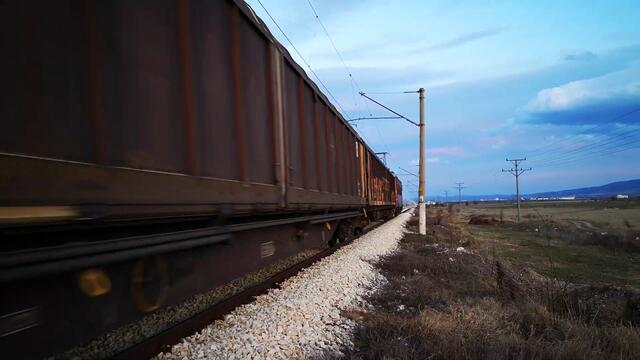 Long and heavy BDZ Freight Train heading from Iskar to Kazichene Train station in Bulgaria