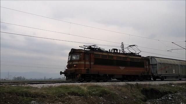 BDZ Freight Trains entering Iskar Train station in Bulgaria around sunset time