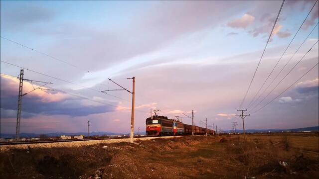 TBD Freight Train with 2 locomotives heading to Iskar train station in Bulgaria around sunset time