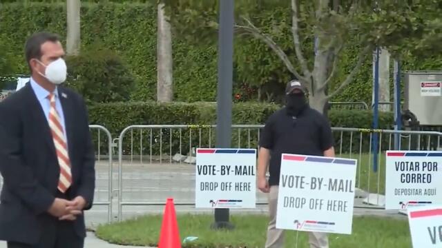 President Donald Trump speaks to reporters after voting in West Palm Beach