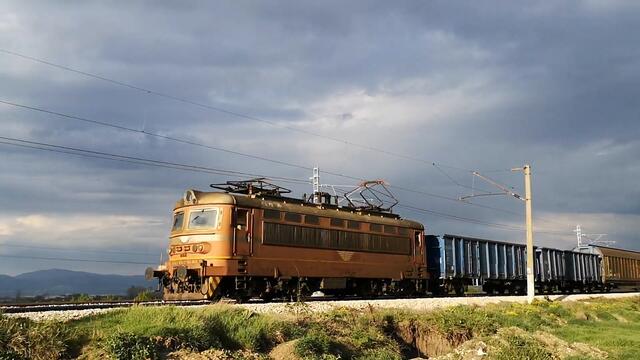 BDZ Freight Train entering Iskar Train station in Bulgaria around sunset time